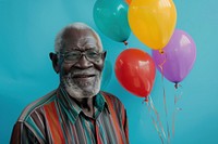 Lovely elderly African man holding balloons happy person people.