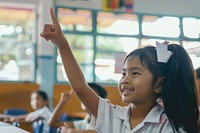 South east Asian girl hand up happy kid student.