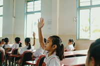 South east Asian girl hand up school kid architecture.