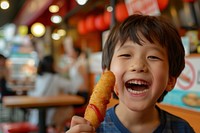 Korean corn dog with ketchup photo happy boy.