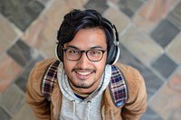 South asian man headphones photo electronics.