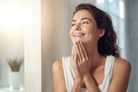 Young woman touching her face happy person female.