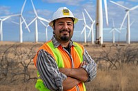 Photo of latino engineer windmill clothing outdoors.