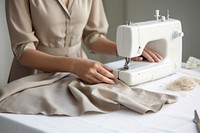 Woman sewing fabric machine appliance weaponry.