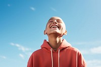 Bald kid laughing clothing apparel person.