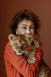 Holding a pet baby lion portrait photo photography.