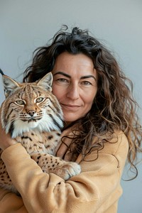 Holding a pet lynx portrait photo photography.