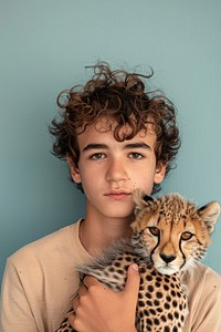 Holding a baby cheetah portrait photo photography.