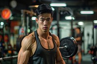 Strong asian man gym barbell sports.