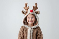 Happy girl in reindeer costume portrait sweater photo.