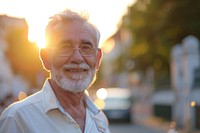 Happy healthy elder man portrait outdoors glasses.