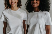 Two women posing for a t-shirt merch drop photoshoot sleeve white togetherness.