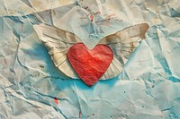 Retro collage of a heart paper wing backgrounds.