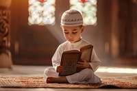 Muslim children reading worship person.
