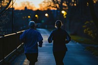 Older man and woman jogging running walking.