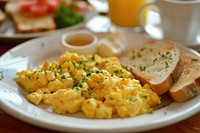 Breakfast with scrambled eggs brunch bread plate.
