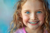Little girl with braces portrait child smiling.