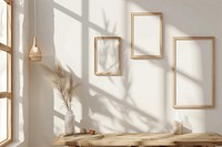 Picture frame mockups on wall furniture wood windowsill.