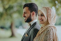 Arabic couple newlywed looking at camara wedding happy bridegroom.