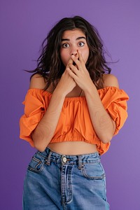 Young shocked scared sad unhappy latin woman she wear orange blouse casual clothes cover mouth with hand frustration front view hairstyle.