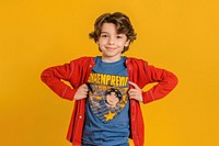 Boy wearing a superhero shirt posing yellow sleeve child.