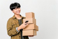 Happy teenager holding stack box cardboard white background mobile phone.