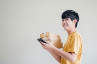 Happy teenager holding stack box mobile phone technology telephone.