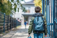 Elementary pupil kid walking bag backpacking.