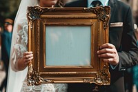 Holds an vintage picture frame mockup wedding bride female.