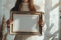 Woman holding vintage picture framemockup painting art photo frame.