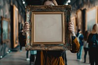 Holds an vintage picture frame mockup art painting female.