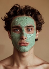 A man with a green facial mask photo skin photography.