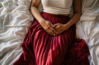 Woman hands holding her stomach blanket female person.