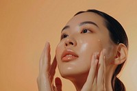 South East Asian woman applying facial serum drops skin sweating female.