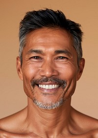 Middle age South East Asian man happy smile photo.