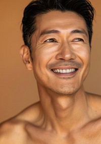 Middle age South East Asian man happy smile dimples.