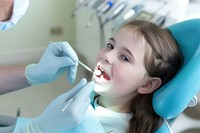 Dentist doing dental treatment dentist child glove.