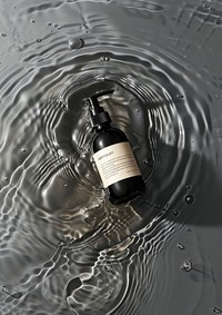 Luxury body wash bottle pump water cosmetics outdoors.
