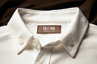 Beige shirt with brown label