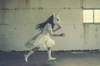 Girlie in unicorn mask recreation performer clothing.