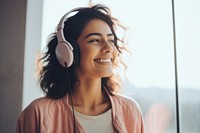 South asian teen woman headphones person smile.