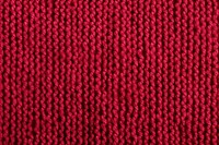 Knit red berry color texture knitting person.