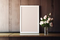 Blank white frame mockup indoors blossom flower.