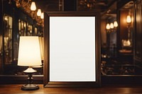 Blank white poster mockup painting indoors lamp.
