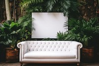 Blank frame mockup couch furniture indoors.