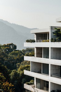 A white concrete building with many floors architecture urban outdoors.