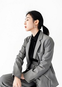 Beautiful korean woman profile view portrait photo suit.