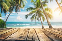 Empty wooden table in front of beach summer ocean tree.