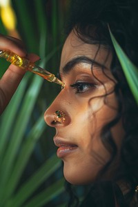 Woman face applying serum skin hairstyle cosmetics.