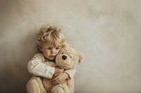 Photo of kid photography teddy bear portrait.